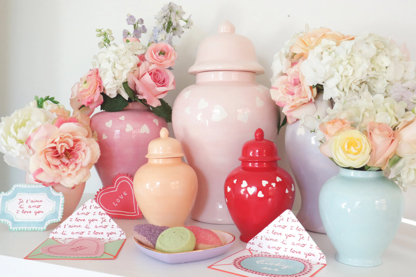 Candid photo of the 'Love is in the Air' red ginger jar in a contemporary setting.