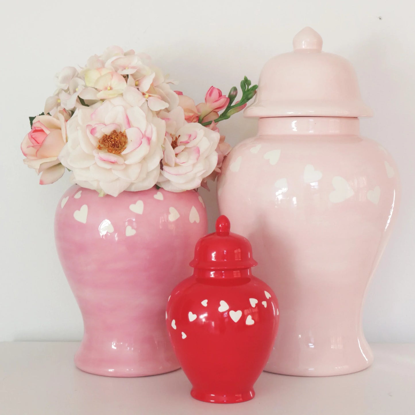 'Love is in the Air' ginger jar in red, perfect for adding a pop of color to any room.